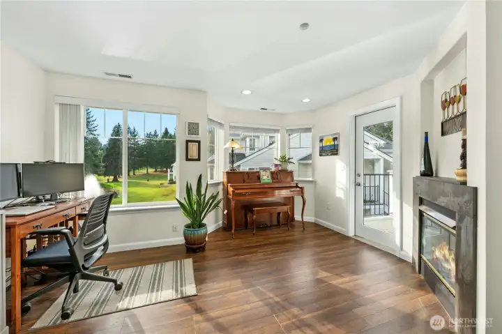 Versital room often used as a family room. Double sided fireplace.