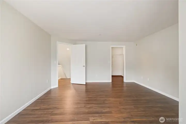 Primary Bedroom from the Windows. On right is large walk-in-closet.