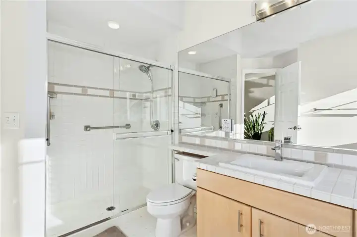 Primary bathroom with walk-in-shower.