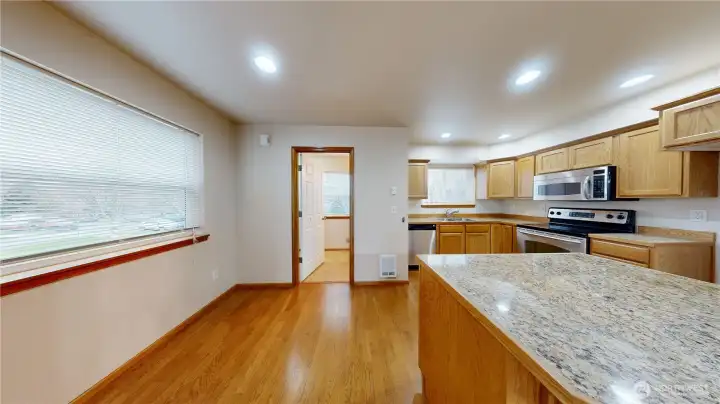 Nice size kitchen with wood floors.