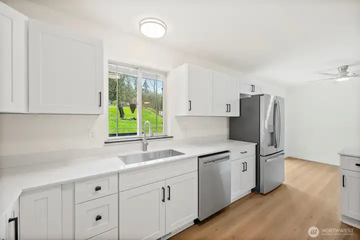 "All new Stainless Steel appliances and deep sink with great view to the back yard"