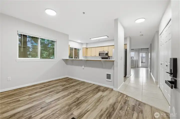 Open feel with the dining area subtly separated from the kitchen.