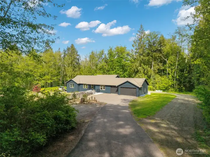 Down a paved driveway, your private oasis awaits!