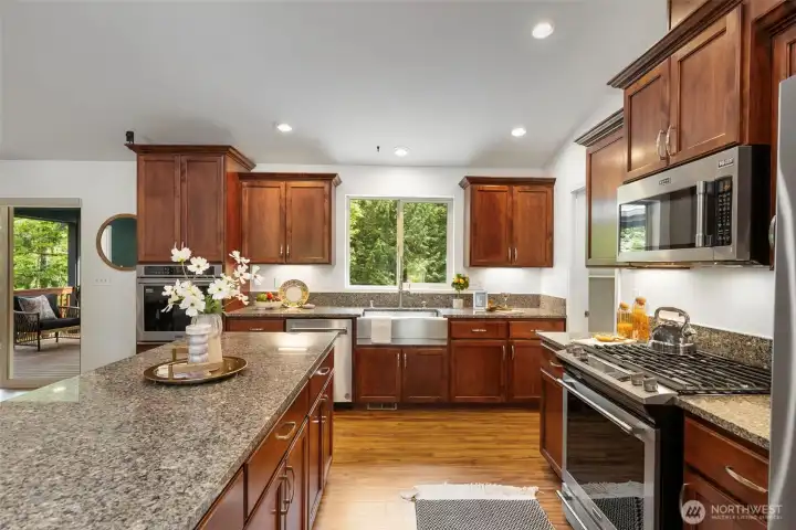 Newer stainless steel appliances, farmhouse sink and huge pantry to the right!