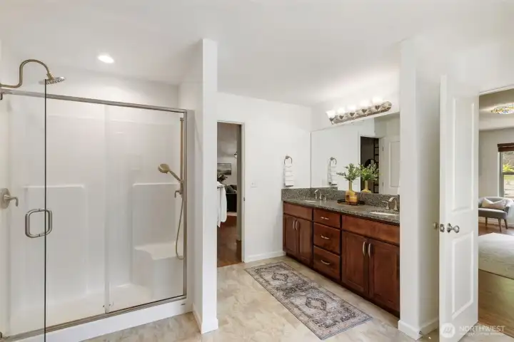 Primary suite with tub, shower, 2 sinks, linen closet AND a generous walk-in closet!