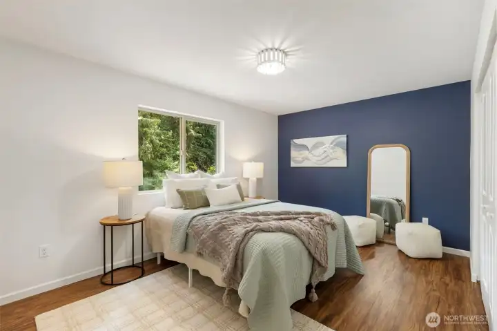 Main floor guest bedroom 1...on opposite side of home from primary.