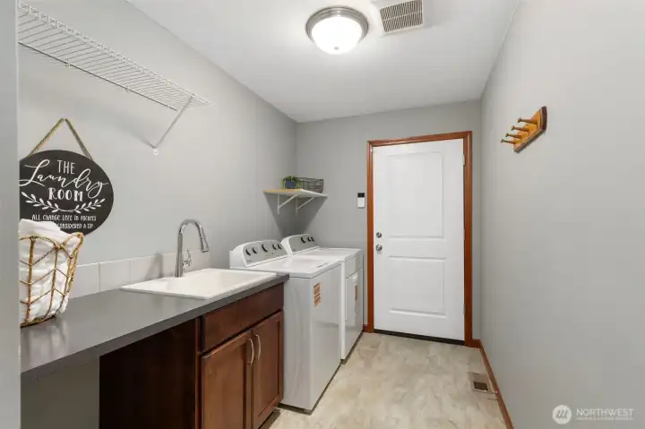 Main floor laundry and access to large 3 car garage.