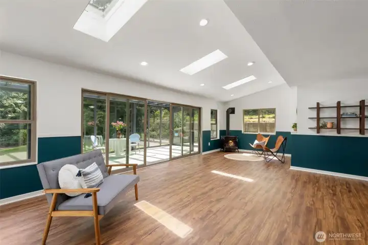 Lower level living/bonus space with HUGE slider to glass room and NEW propane stove!