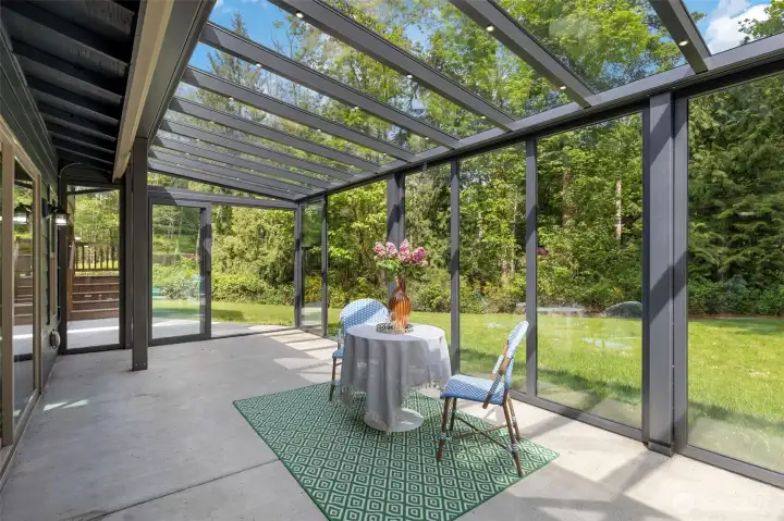 Gorgeous glass room with light built into the ceiling and doors that all slide open. The BEST indoor/outdoor setup! Over 300 sq ft (not included in total square footage).