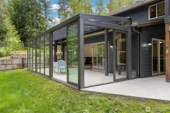Gorgeous glass room with light built into the ceiling and doors that all slide open. The BEST indoor/outdoor setup! Over 300 sq ft (not included in total square footage).