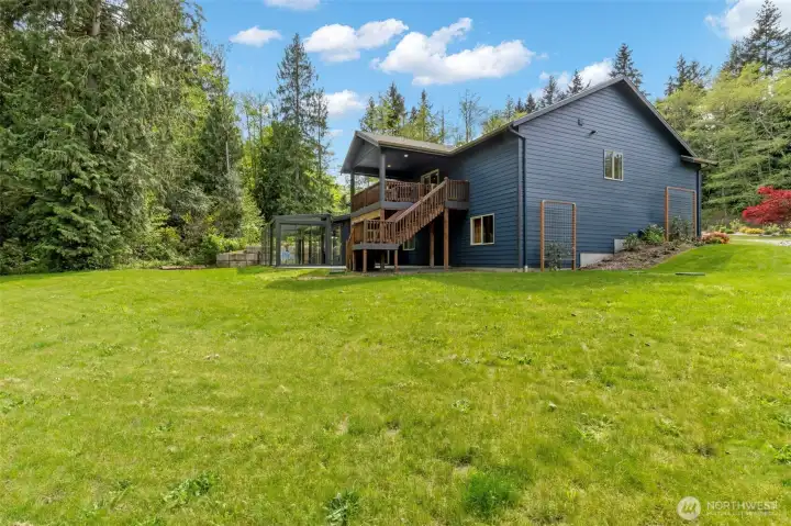 So much open space, a covered deck, a glass sunroom, gardens, professional landscaping, auto transfer generator, heat pump to keep you cool and space for RV/BOAT...shop potential?
