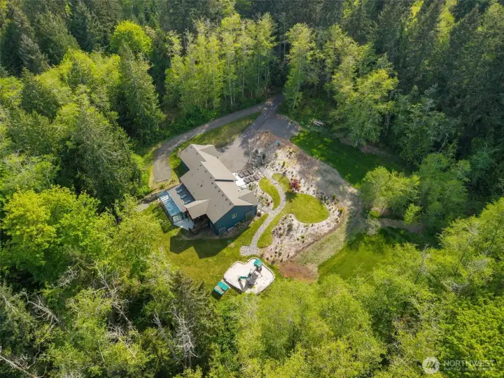 So much open space, a covered deck, a glass sunroom, gardens, professional landscaping, auto transfer generator, heat pump to keep you cool and space for RV/BOAT...shop potential?