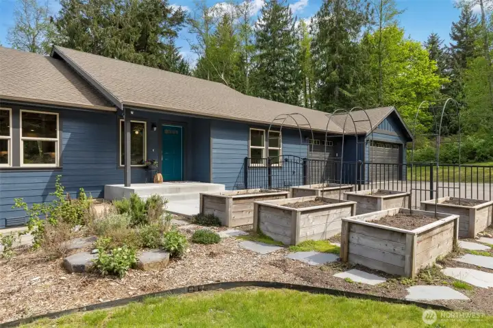 So much open space, a covered deck, a glass sunroom, gardens, professional landscaping, auto transfer generator, heat pump to keep you cool and space for RV/BOAT...shop potential?