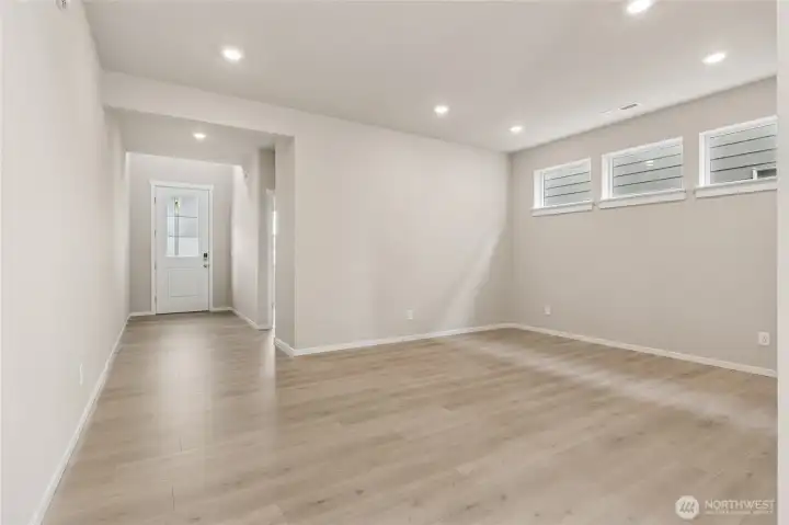 Wide open and bright entry showing the main floor bedroom. Photos are representative only and may display different color package and/or upgrades.
