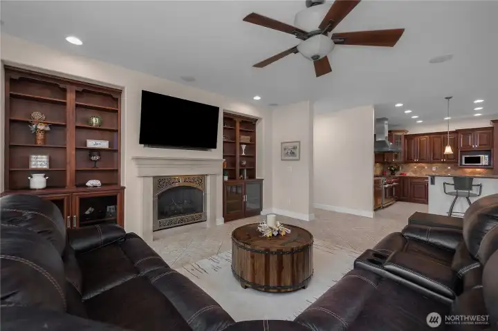 Enjoy open living with a fireplace, built-ins, and easy flow to the kitchen.