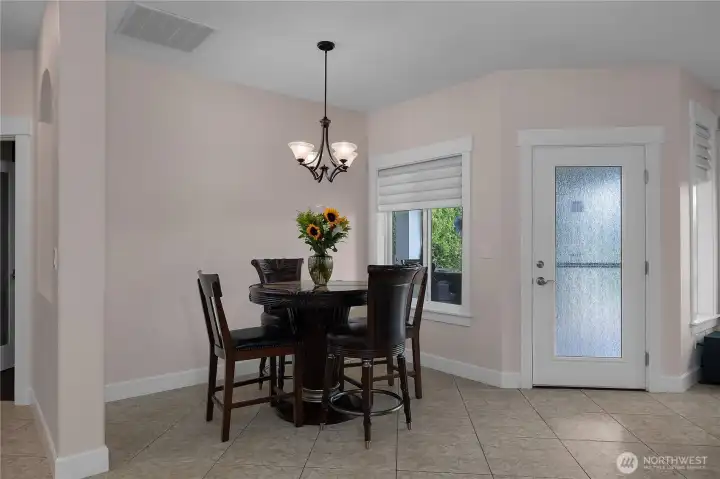 Start the day in a cozy dining nook with patio access and natural light.