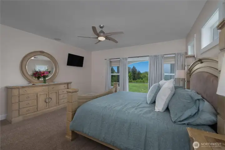 Wake up to private backyard views from the spacious primary suite.