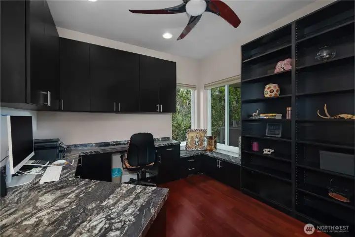 Work comfortably from a finished private office with built-in cabinetry and generous workspace.