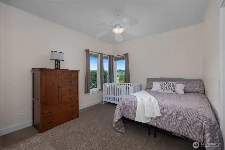 BR 2 - This bedroom offers a clean layout, neutral finishes, and peaceful window views.