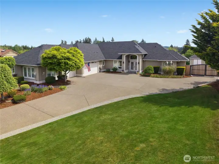 The front exterior offers strong curb appeal, mature plantings, and an inviting entry.