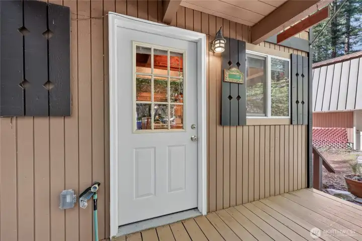 Covered front entry offering protected access into the home. Covered front entry offering protected access into the home.