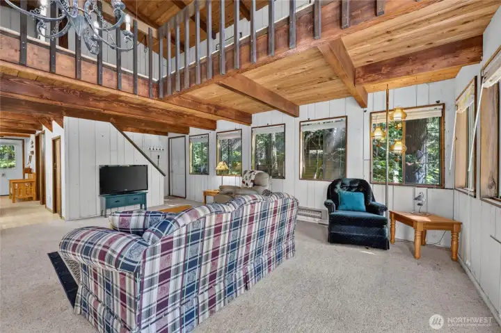 Additional perspective of the great room highlighting the vaulted ceiling and open floor plan. Additional perspective of the great room highlighting the vaulted ceiling and open floor plan.