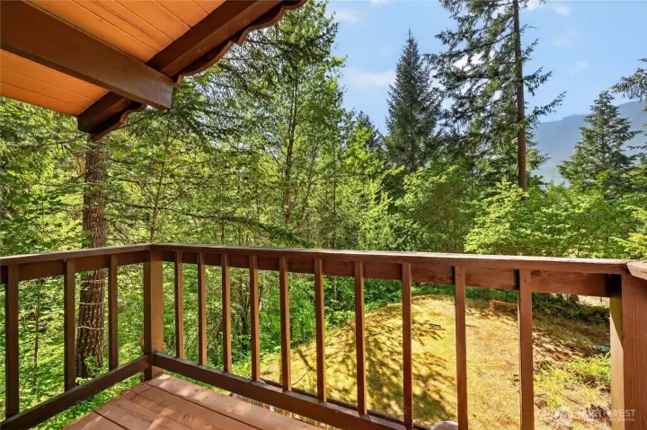 Upper-level deck overlooking the wooded setting. Upper-level deck overlooking the wooded setting.