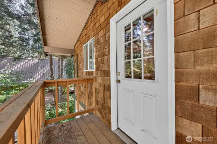 Private balcony accessible from the primary suite overlooking the wooded property. Private balcony accessible from the primary suite overlooking the wooded property.