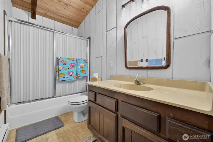 Upper-level bathroom with oversized vanity and additional storage. Upper-level bathroom with oversized vanity and additional storage.