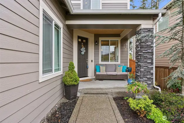 A front porch that is sure to welcome guests and this home has extra stone on the exterior that was an upgrade in 2018
