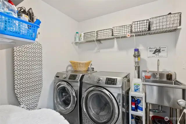 A perfectly located utility room upstairs includes a sink and the washer and dryer are included.