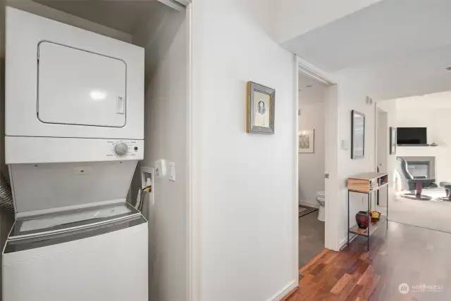 New stacked washer and dryer in utility closet.