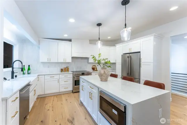 Beautiful white marbled quartz throughout kitchen