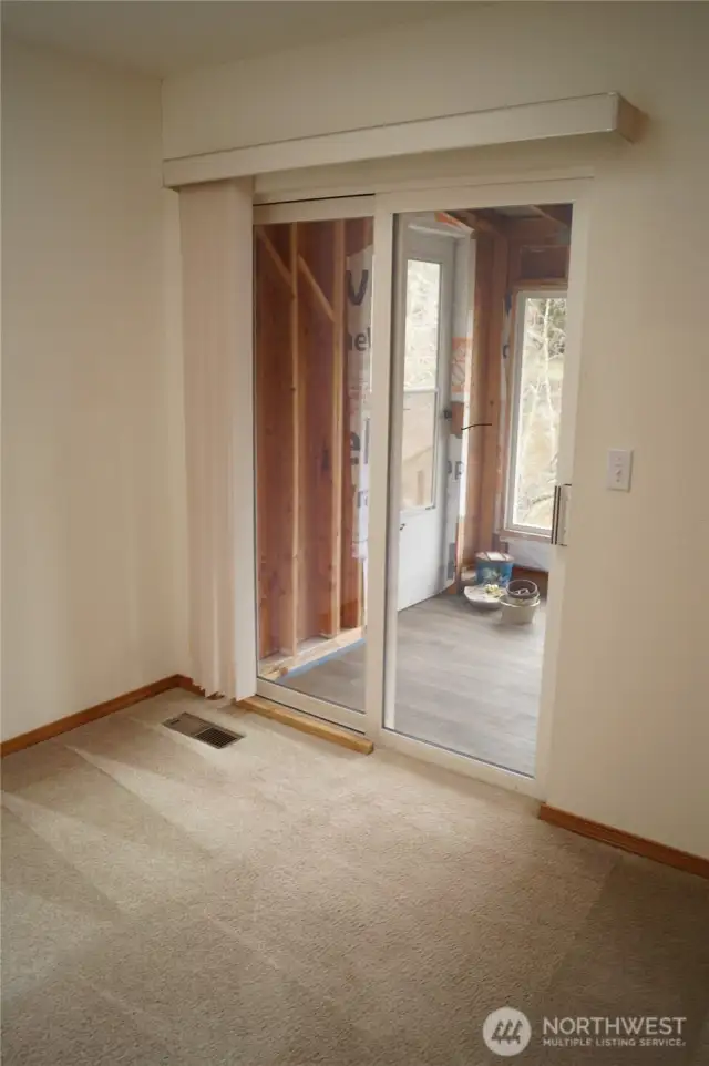 Door to enclosed porch off living room