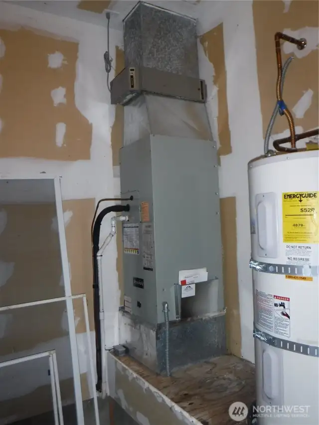 Heat pump/hot water tank in garage
