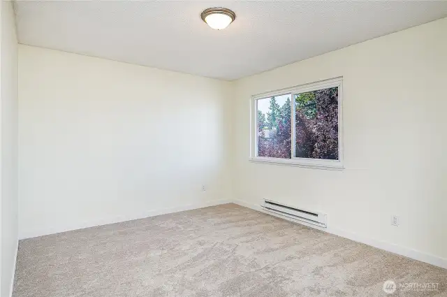 Generously sized second bedroom upstairs.