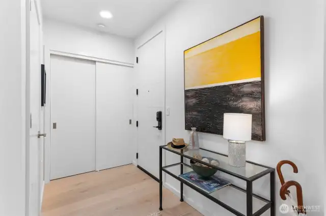 Entry closet and utility closet features the units hot water heater