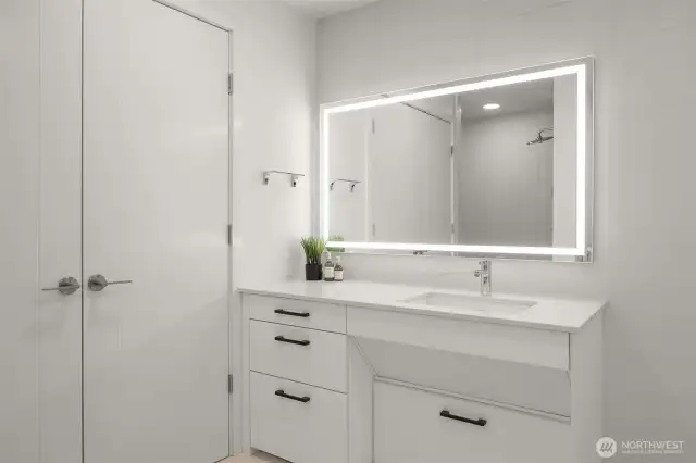 Bathroom features an in-unit Miele washer and dryer
