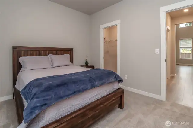 Downstairs bedroom for guests with bathroom right next door and walk in closet.