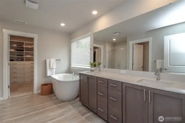Spacious primary bathroom with soaking tub.