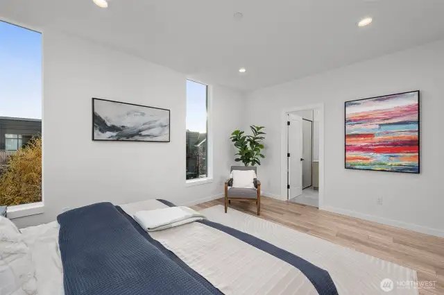 The expansive primary suite has space to create a nook to read in the morning, creating the perfect retreat for relaxation and inspiration.