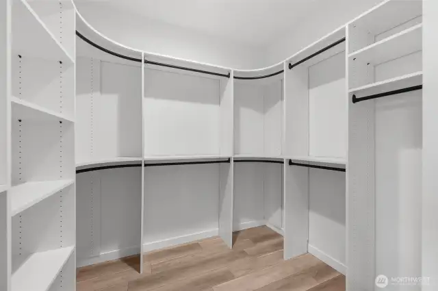 Say goodbye to clutter with this custom-designed walk-in closet offering plenty of storage and organization space. A dream come true for any wardrobe.