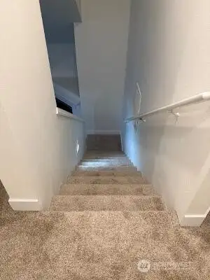 View of stairs from second floor