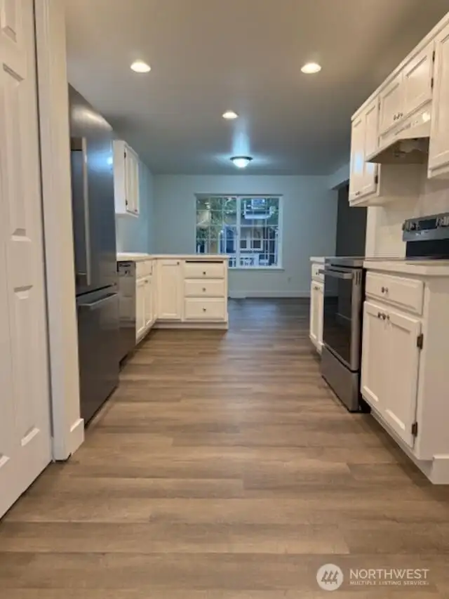 View of kitchen from backside of house looking toward front home and dining area