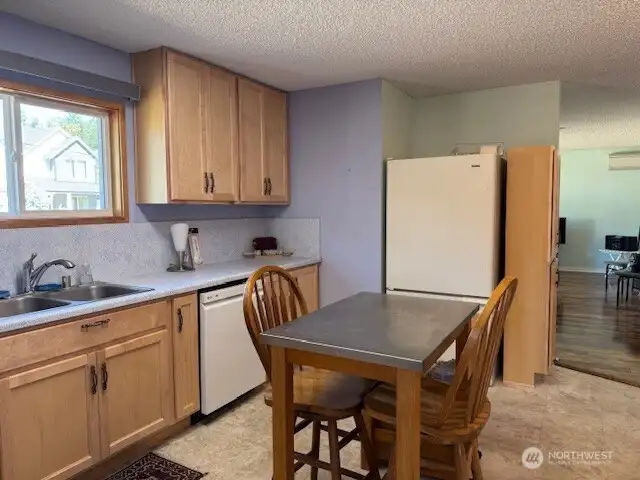 Notice the blinds are open! Lots of storage in this kitchen!
