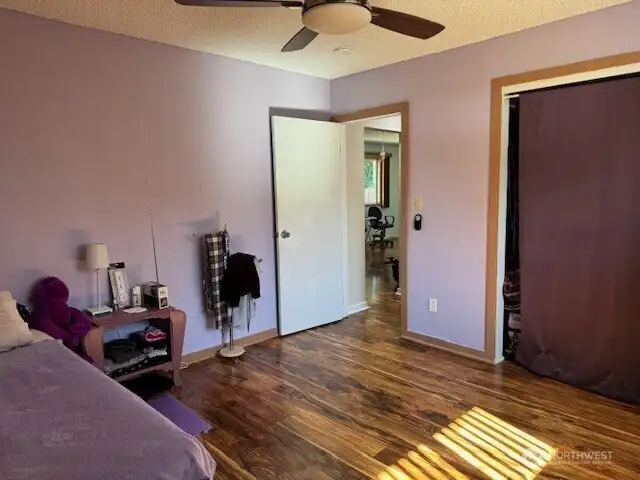 Another view of the 2nd bedroom towards the hallway. this room also has a mini-split and a lighted fan.