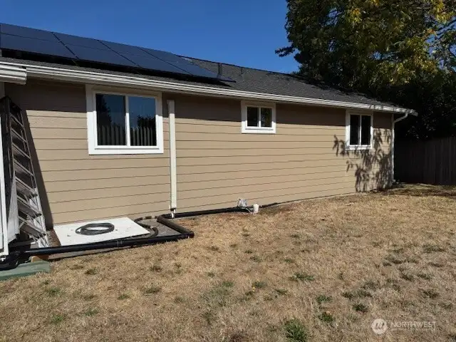 You can see the solar panels on the roof. The white cover takes you down into the crawl space.