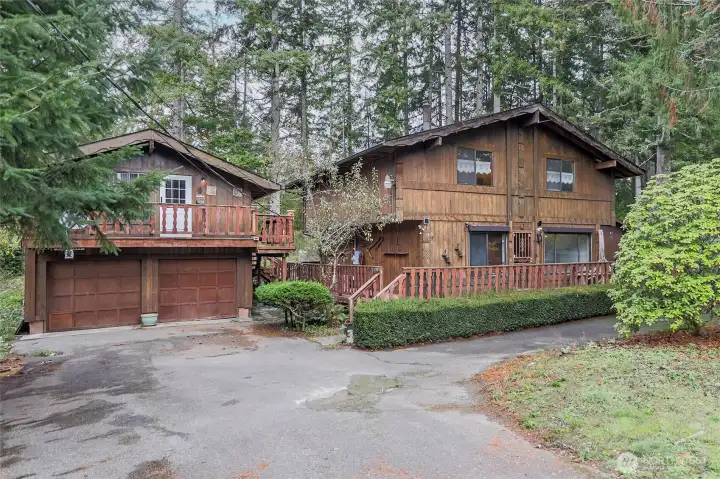 On the left is the detached 2 car garage with carriage house above--use for studio, office or guests.