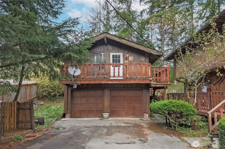 Good sized two car detached garage with a carriage house accessed by back steps.