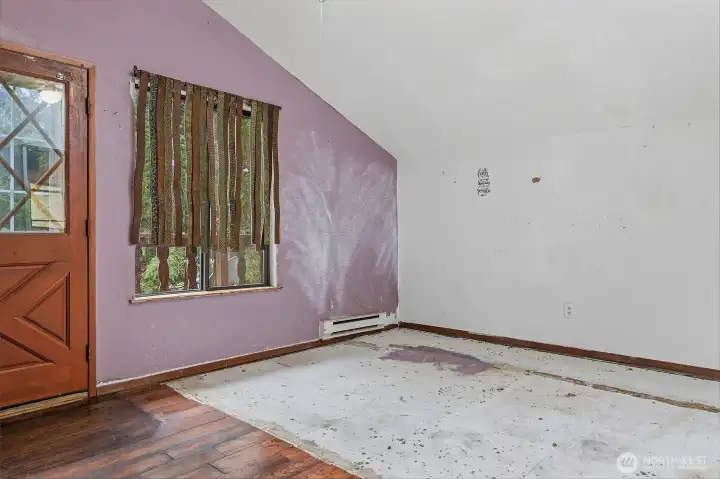 Vaulted ceiling in great room as you enter